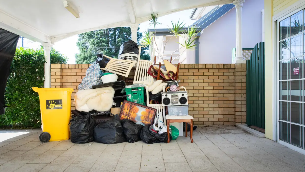 Household Clearance And You with Expert Guide By Goodbye Junk Rubbish Removal 4 rubbish collected in a house beside the famous yellow goodbye junk bin